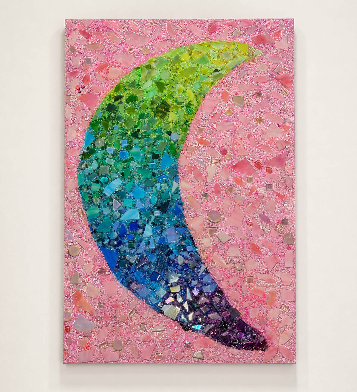 Pastel moon mosaic wall art with pink background and colorful glass detail